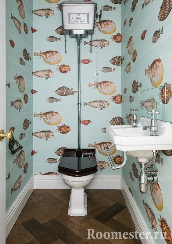 Small toilet with wallpaper on the walls