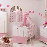Pink and white furniture in the nursery