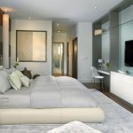 Slaapkamer met spiegel en tv