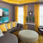 The combination of yellow curtains and gray walls