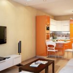 Orange kitchen furniture in the interior