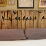 Headboard made of boards with birds