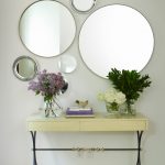 Round mirrors above the table