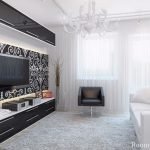 Hvit sofa og svart lenestol i stuen