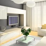 Комбинацията от сива стена и бели мебели в хола