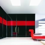 Corner black wardrobe with a red stripe