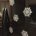 Snowflakes on a black refrigerator