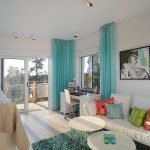 Turquoise rug and curtains in the interior