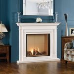 The combination of blue walls and a white fireplace