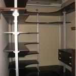 Hinged shelves in a small storage room