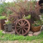 Flowerbed with wheel and barrel
