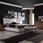 Matte black walls and ceiling in the bedroom