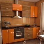 Дървени оранжеви мебели в кухнята