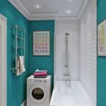 Azulejos turquesas no banheiro com uma máquina de lavar