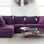 Spacious purple sofa with pillows