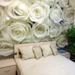 White roses in the decor of the bedroom