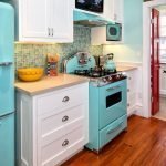 Turquoise stove and refrigerator in the kitchen