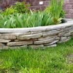 round sandstone flowerbed