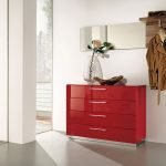Red chest of drawers in a white interior