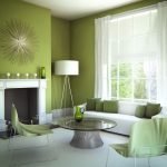 White fireplace in a green interior