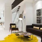 Yellow carpet and black furniture