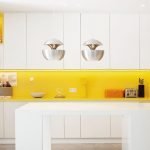 A combination of a yellow apron and white furniture