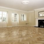 Parquet floor room with fireplace