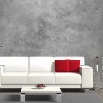 Hvit sofa på en grå bakgrunn