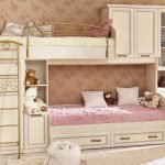 Pink and beige nursery with bunk bed