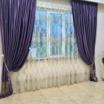 White curtains and purple curtains on the window