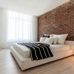 Brick wall in bedroom design