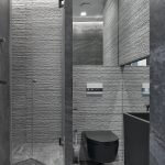 Pilkos tekstūros plytelės tualete