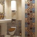 Tile with colored ornament in the toilet