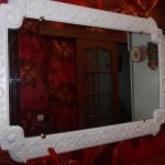 Mirror with a frame