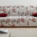 Case with roses on the sofa