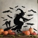 Cat and witch on a broomstick