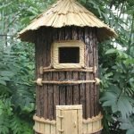 Cylindrical birdhouse made of twigs