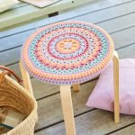Knitted seat stool on a round stool