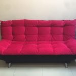 Raspberry sofa in the interior