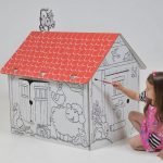 Girl paints a house