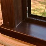 Wooden platband on the windowsill