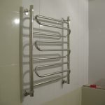 Heated towel rail on the wall